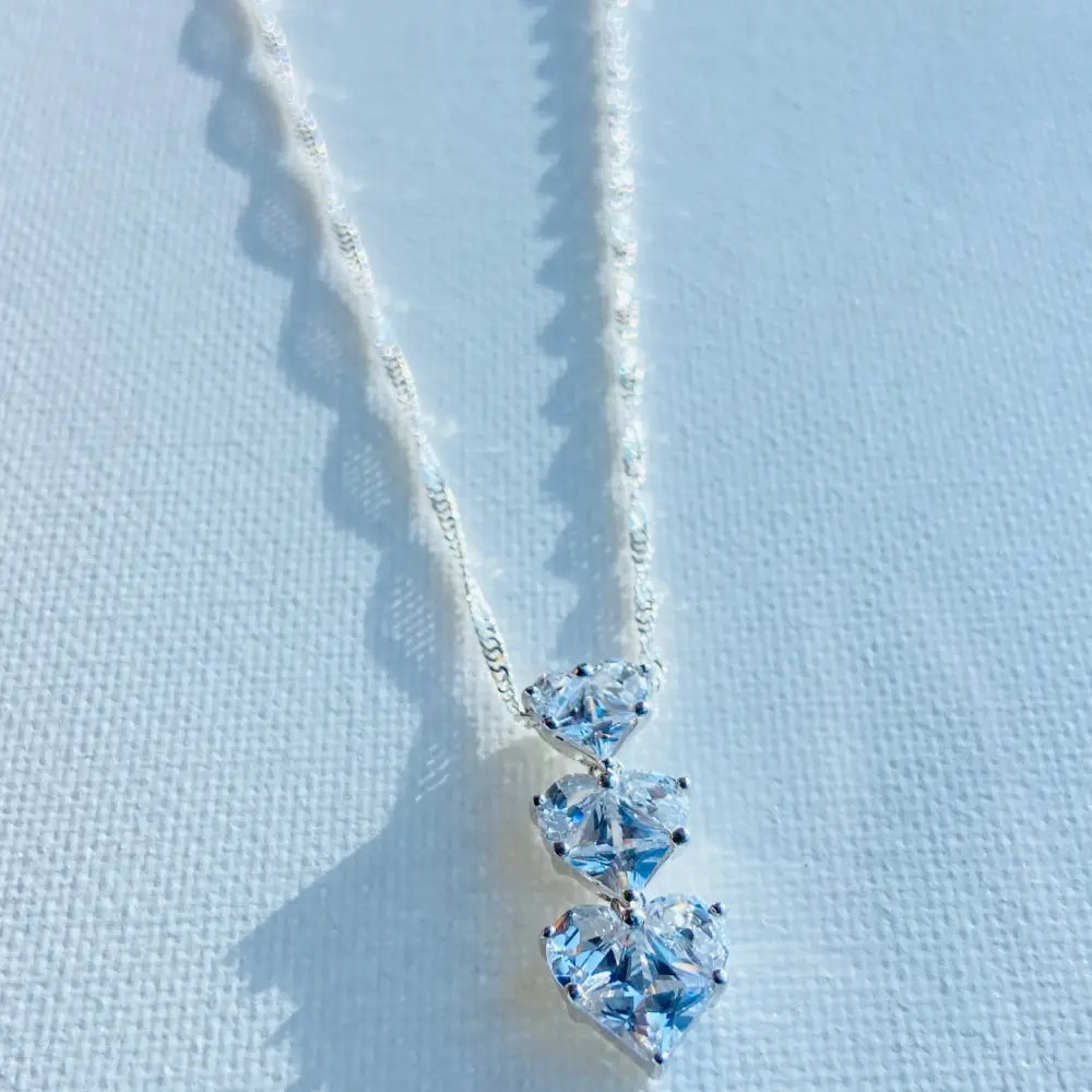 Silver three tier necklace with three heart-shaped cubic zirconia pendants in white gold shine. Jewellery silver jewellery Deep Shine Jewellers