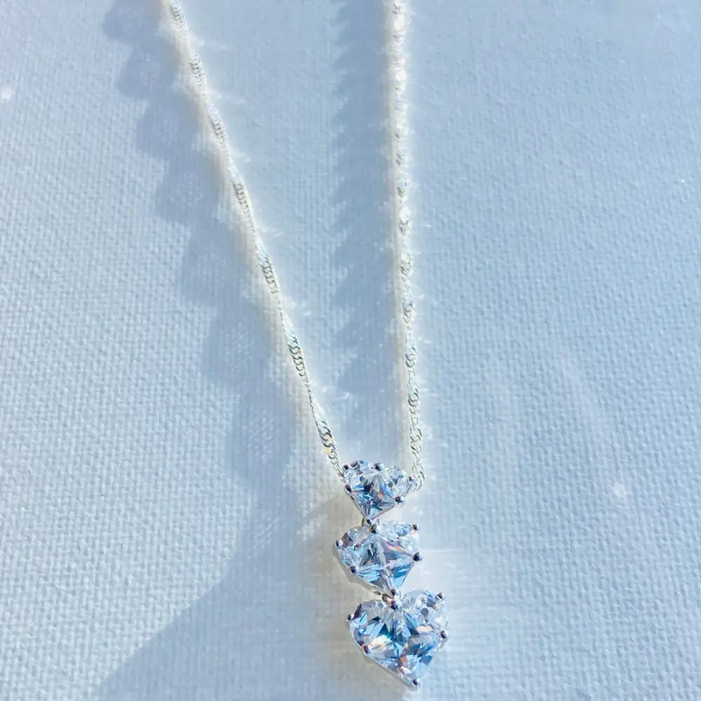 Silver three tier necklace with three heart-shaped cubic zirconia pendants in white gold shine. Jewellery silver jewellery Deep Shine Jewellers