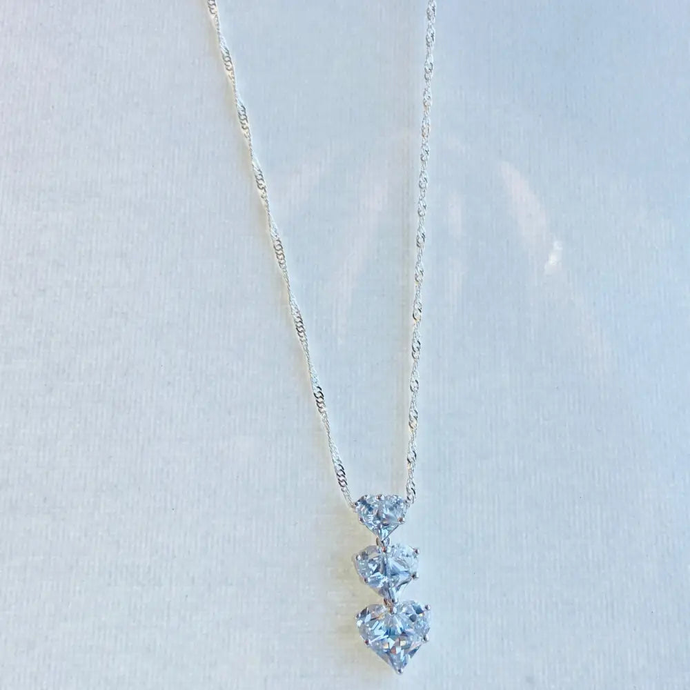 Silver three tier necklace with three heart-shaped cubic zirconia pendants in white gold shine. Jewellery silver jewellery Deep Shine Jewellers