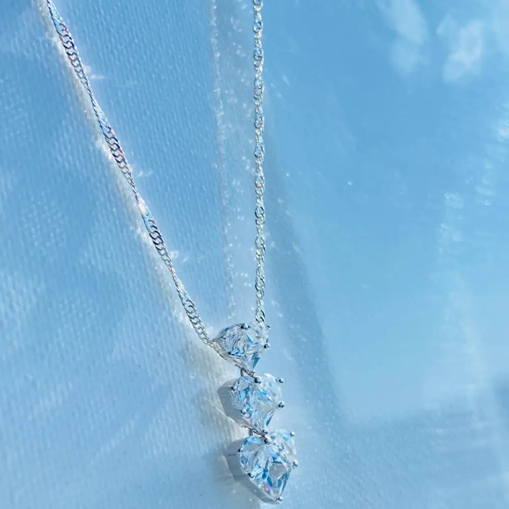 Silver three tier necklace with three sparkling heart-shaped pendants in white gold silver finish. Jewellery silver jewellery Deep Shine Jewellers