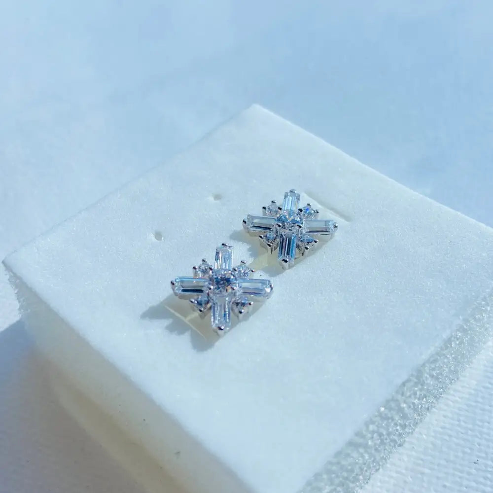 Dazzling white gold silver starburst diamond studs with baguette and round brilliant diamonds