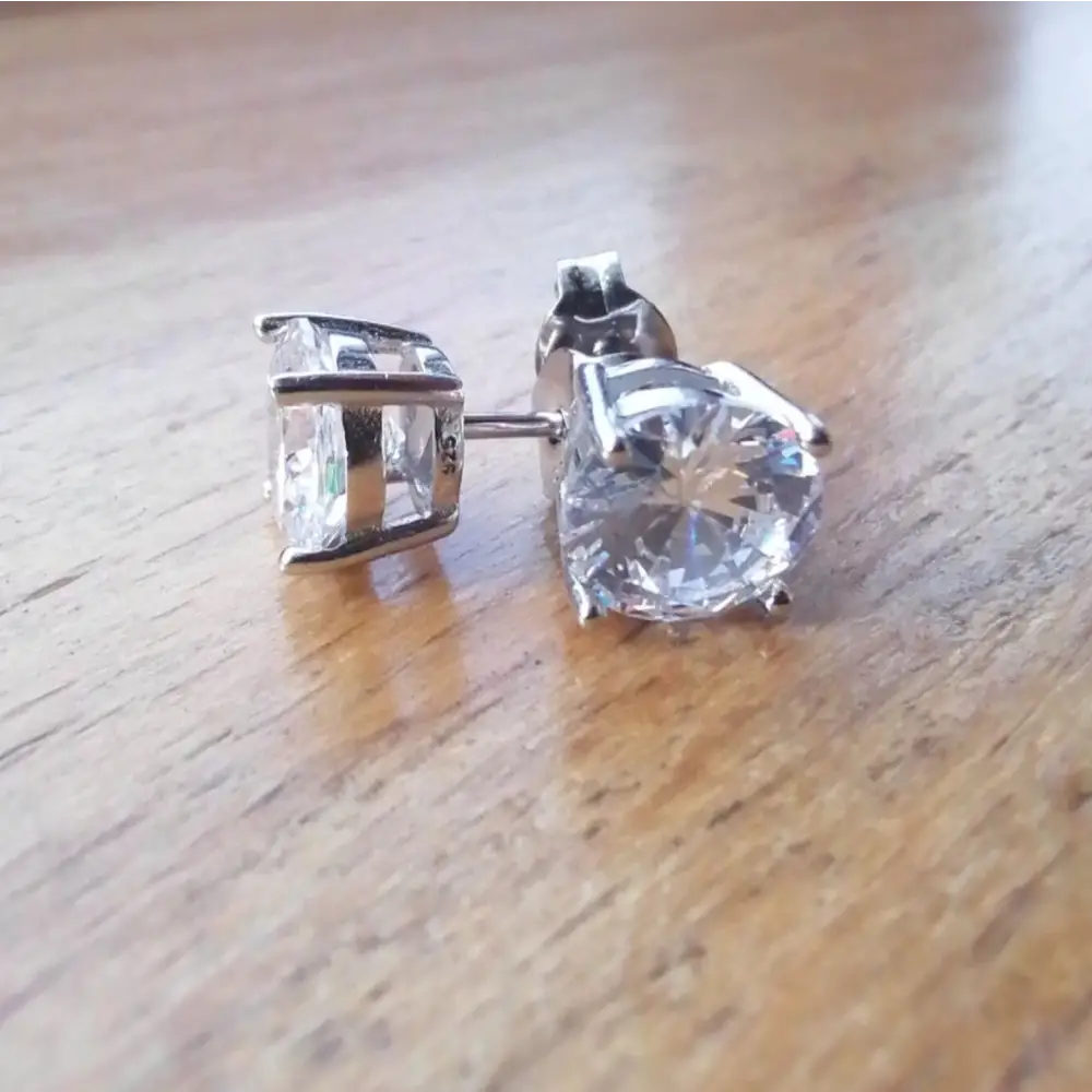 Deep Shine Silver Cubic Claw Earrings with clear faceted gemstone studs