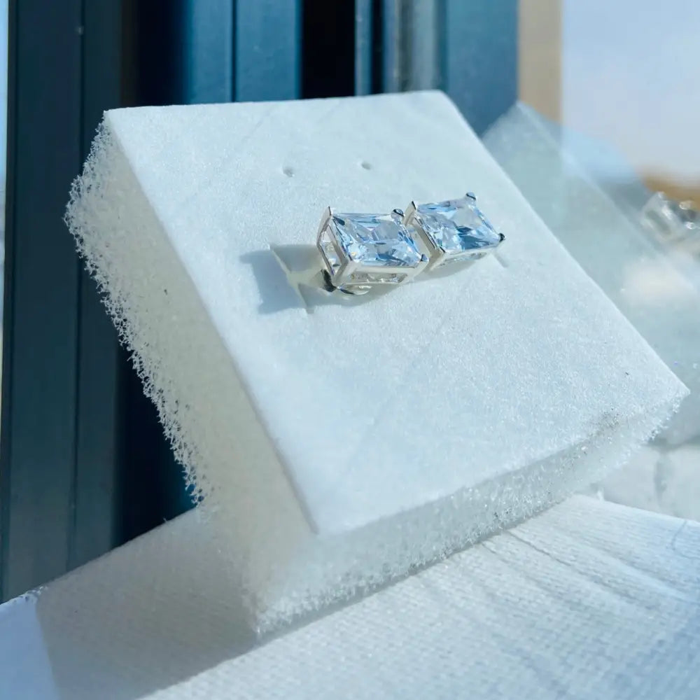 White gold silver rectangle four cubic zirconia earrings in a sleek gold silver rectangle design