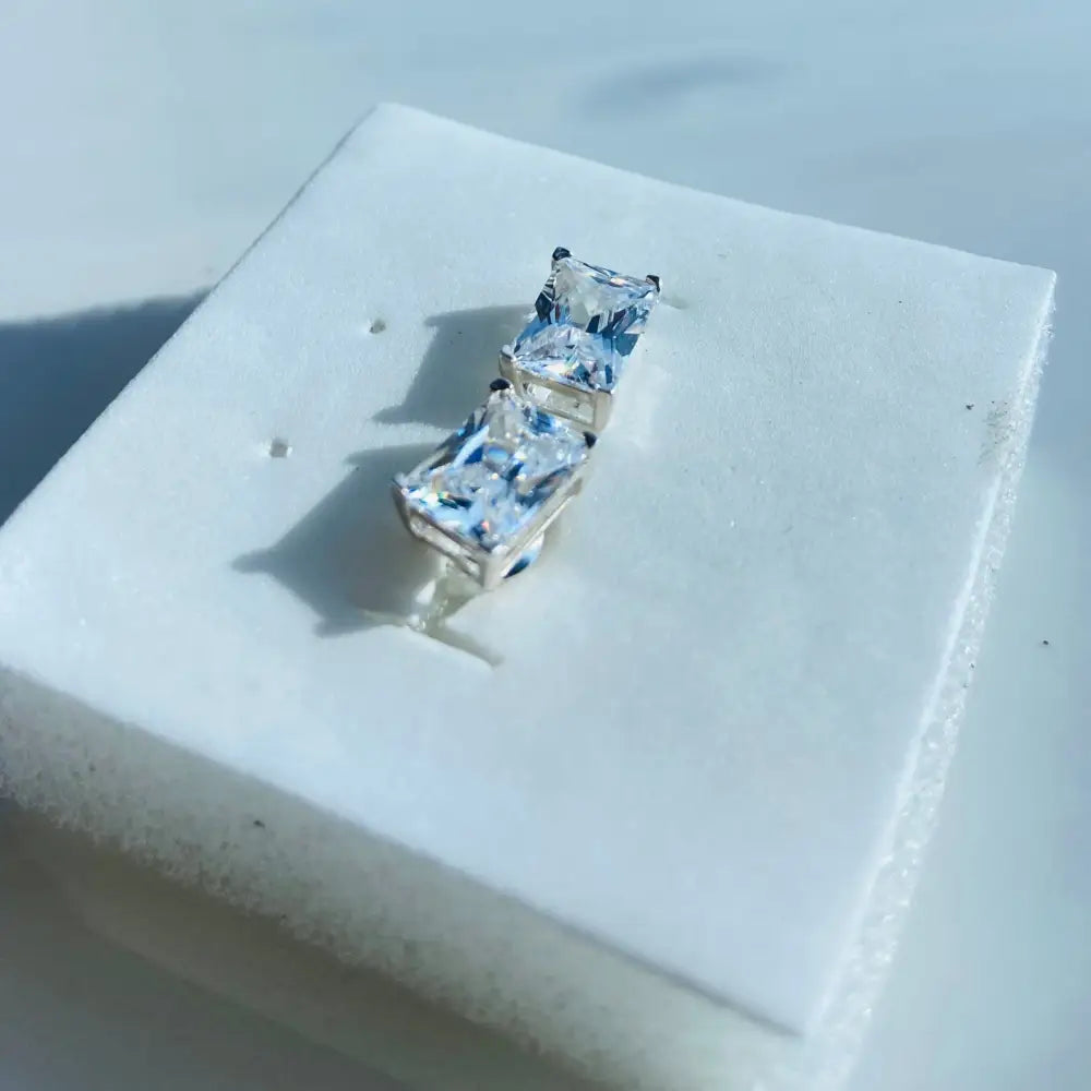 White gold silver rectangle four cubic zirconia earrings in a sleek gold silver rectangle design