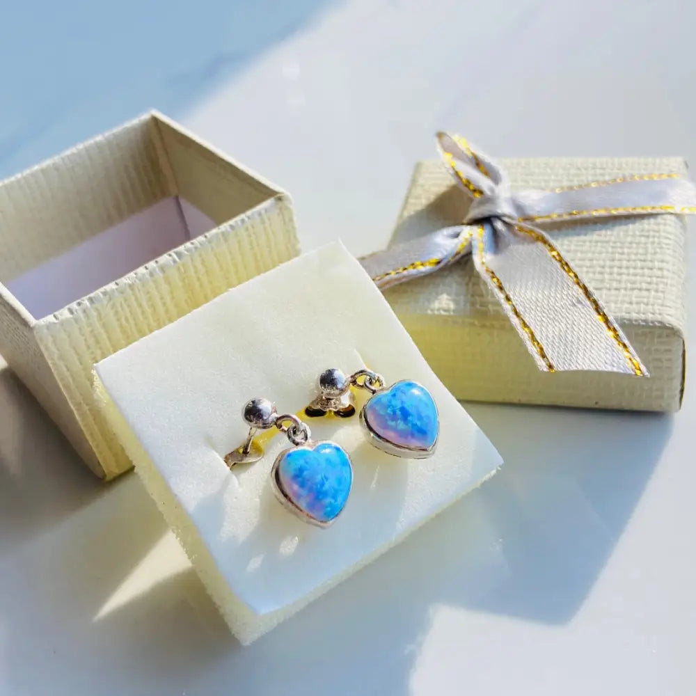 Silver earrings featuring heart-shaped blue opals in the Enchanting Heart Opals Set