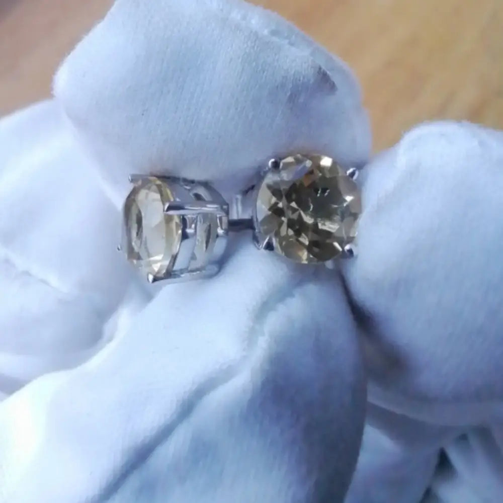 Silver rings with yellow gemstones in white gold silver claw settings for elegant jewelry