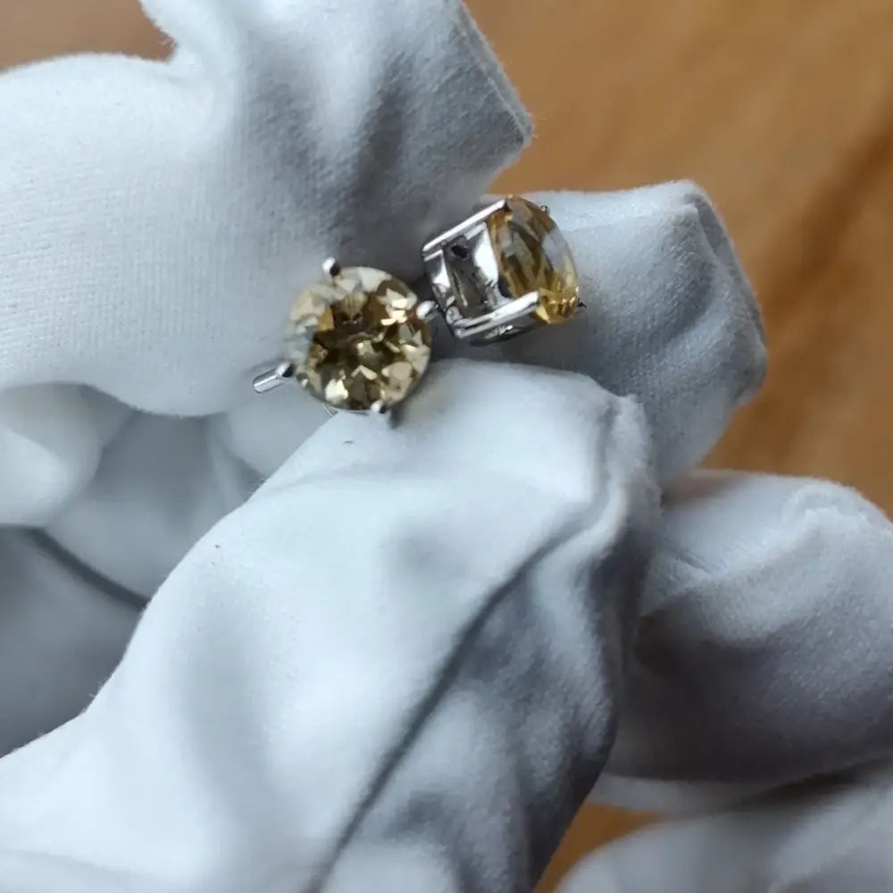 White gold silver claw precious citrine stud earrings with brown and yellow gemstones