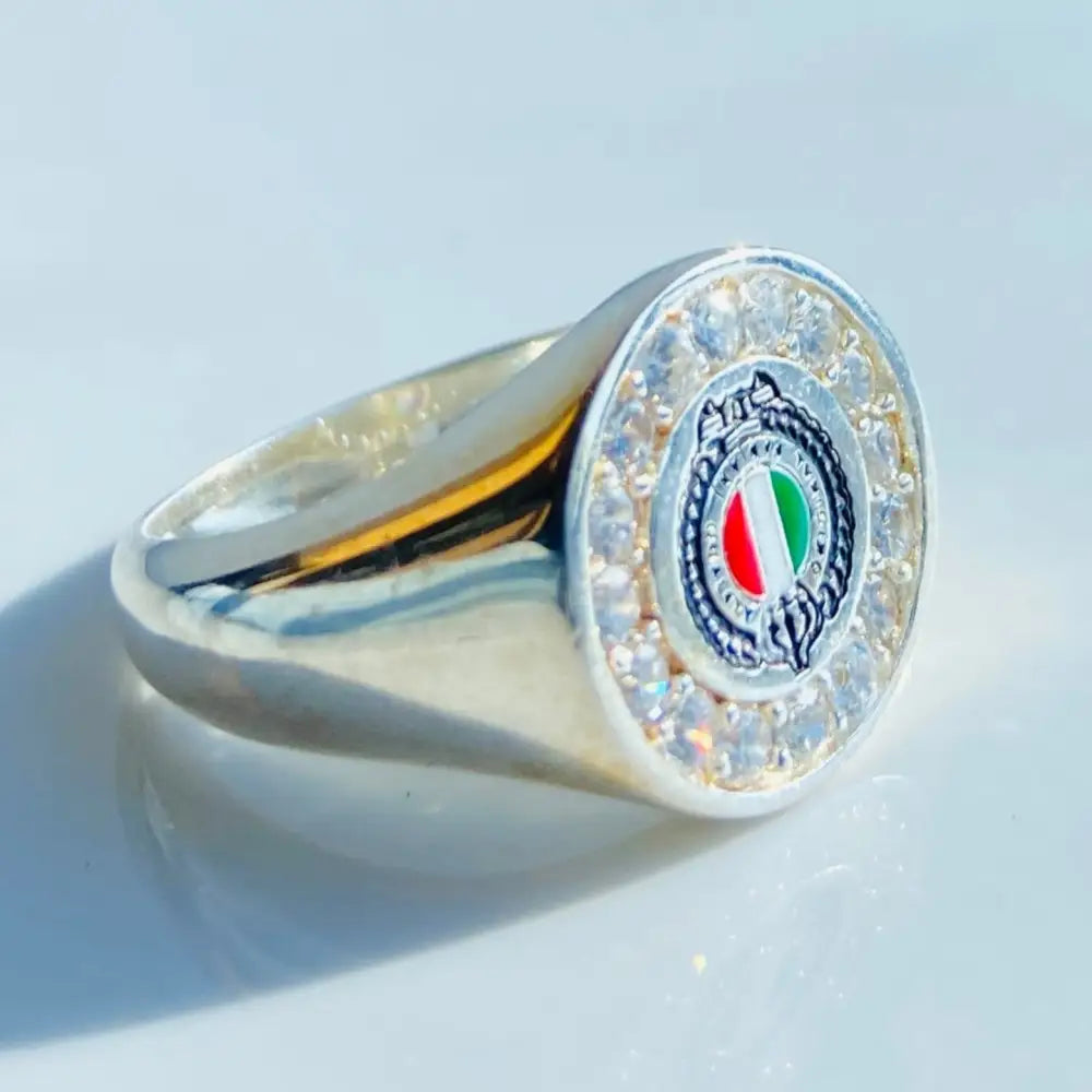 Silver Fabiani ring with a circular emblem and clear gemstones in a luxurious design