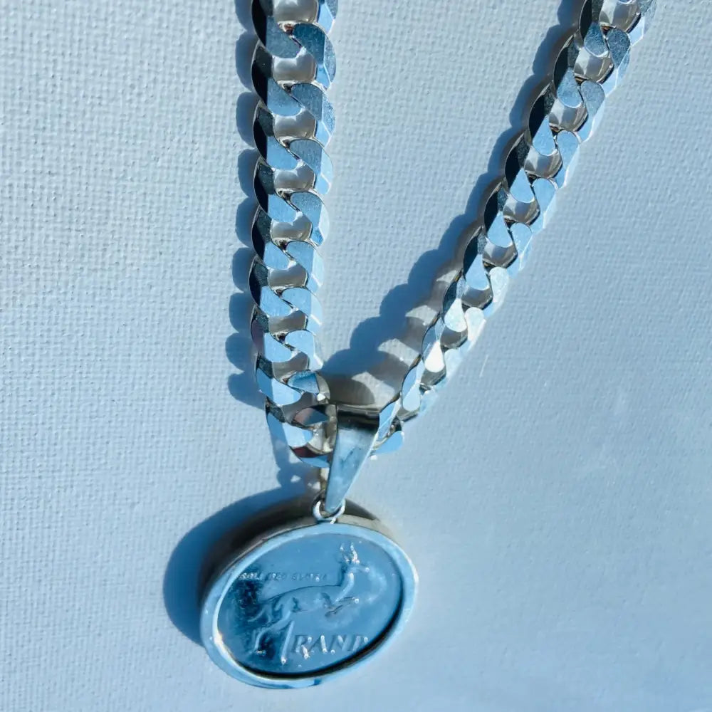 Silver flat curb necklace with South African 1 Rand coin pendant, Radiant Rand statement jewelry. jewellery silver jewellery. Deep Shine Jewellers