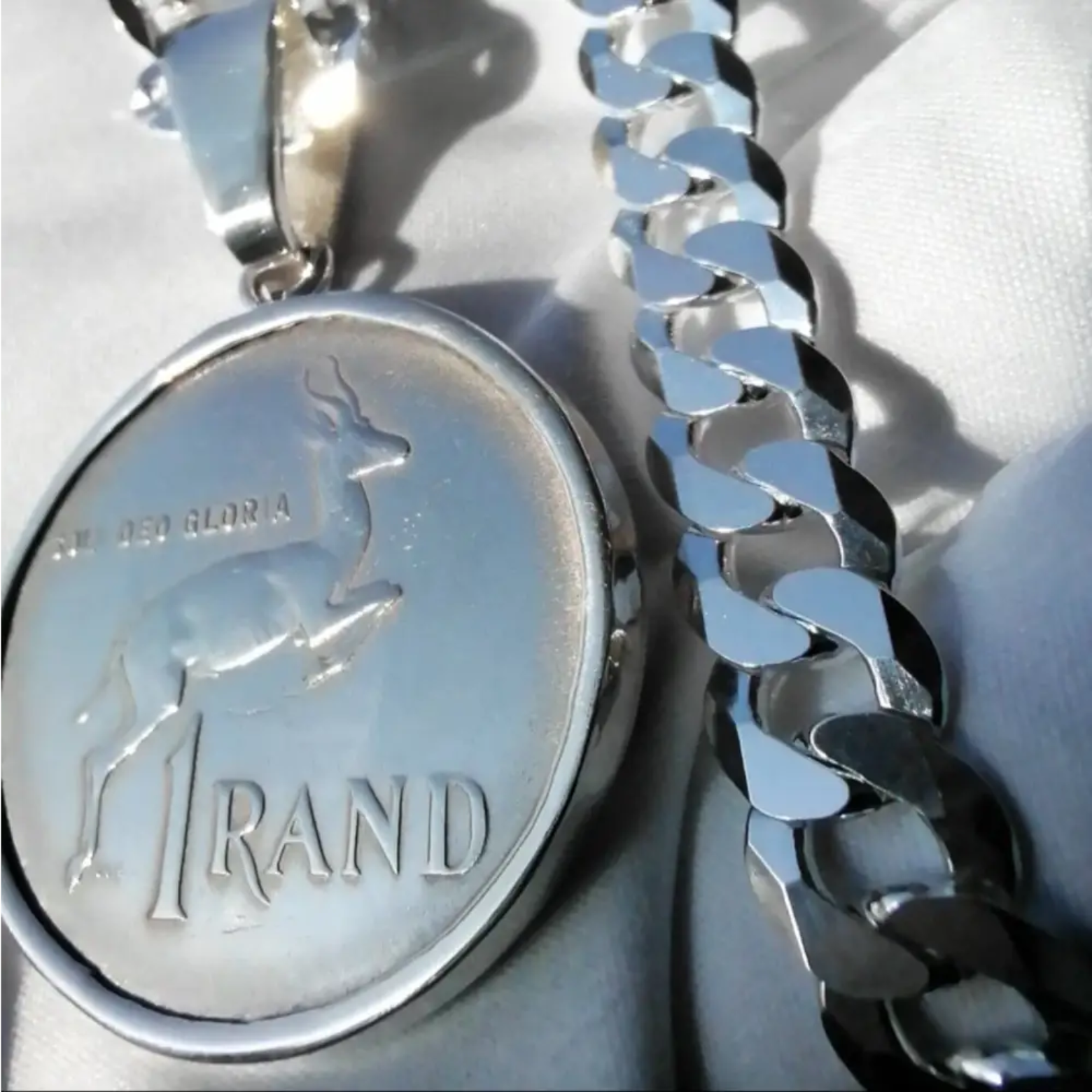 Silver flat curb necklace with springbok pendant and 1 RAND special. jewellery silver jewellery. Deep Shine Jewellers