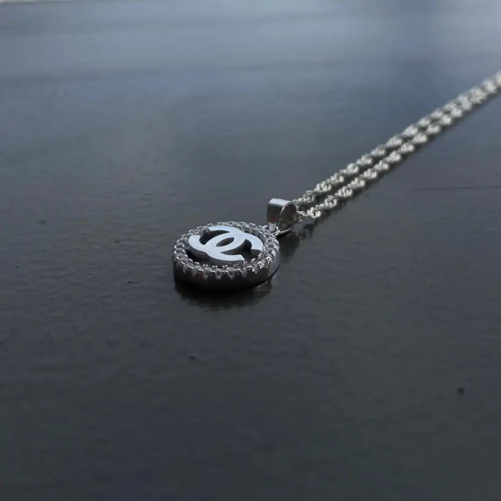 Silver Chanel necklace with pavé-set interlocking Cs pendant for timeless elegance