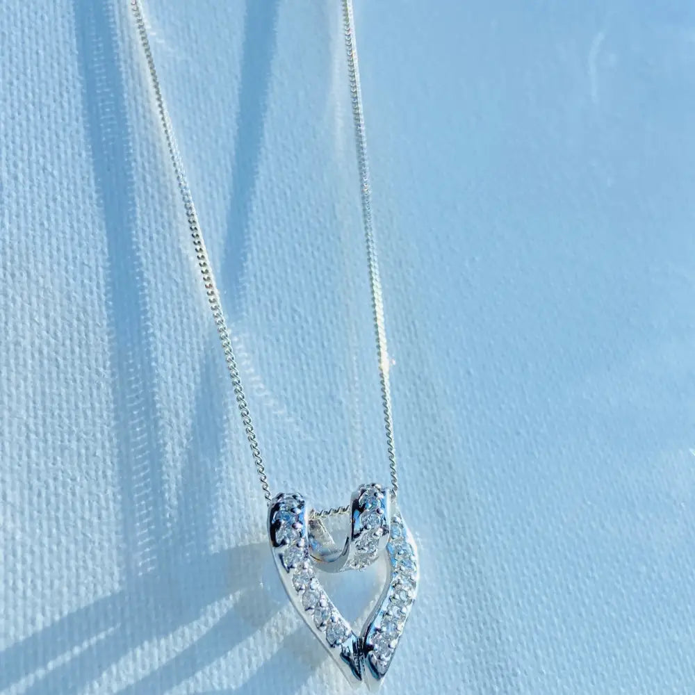 Silver looped heart necklace with diamond-encrusted pendant, perfect in white gold silver style