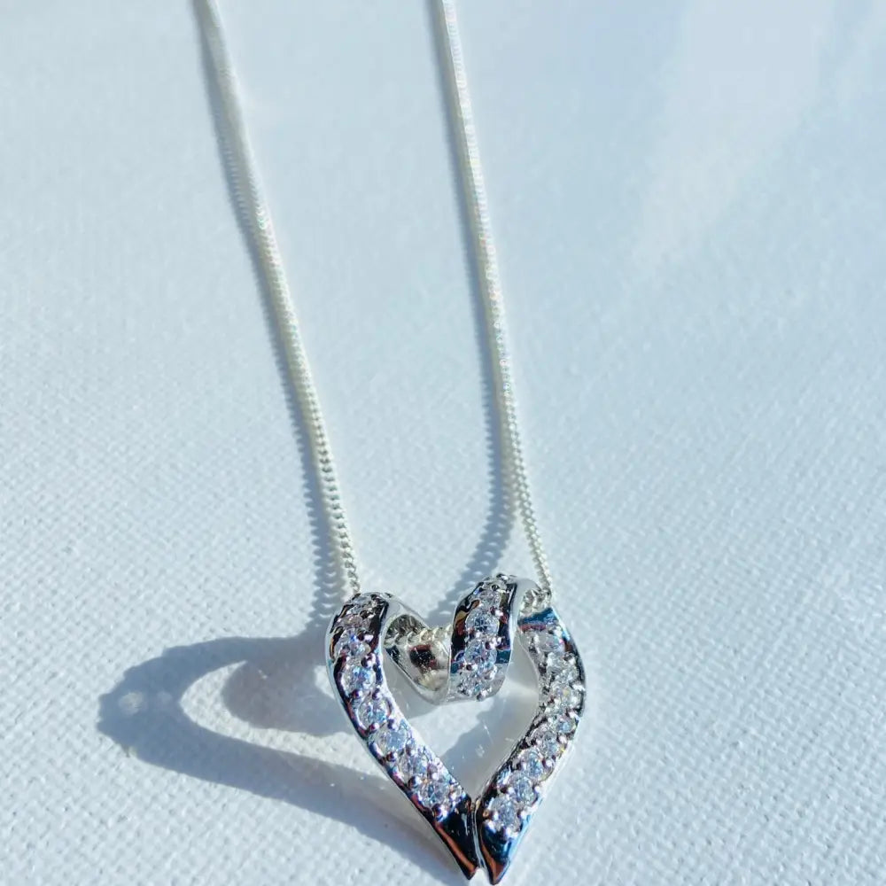 Silver looped heart pendant necklace with sparkling diamonds in Radiant Silver Looped Heart design