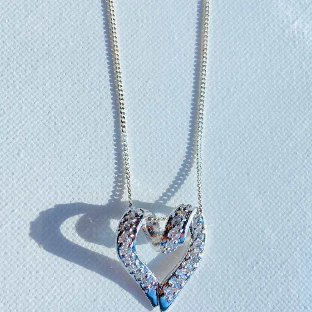 Silver looped heart necklace with diamond pendant, perfect for elegant white gold silver jewelry
