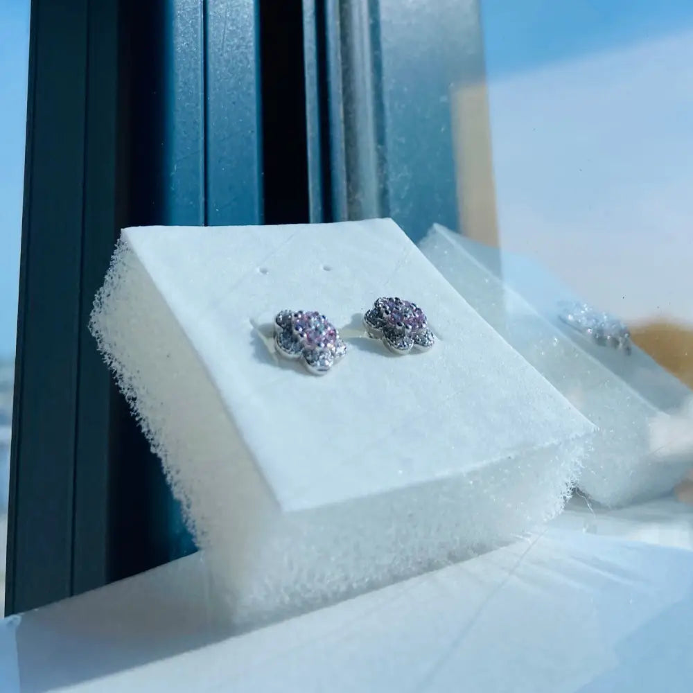 Silver pink rose stud earrings with purple and clear gemstones in white gold silver finish