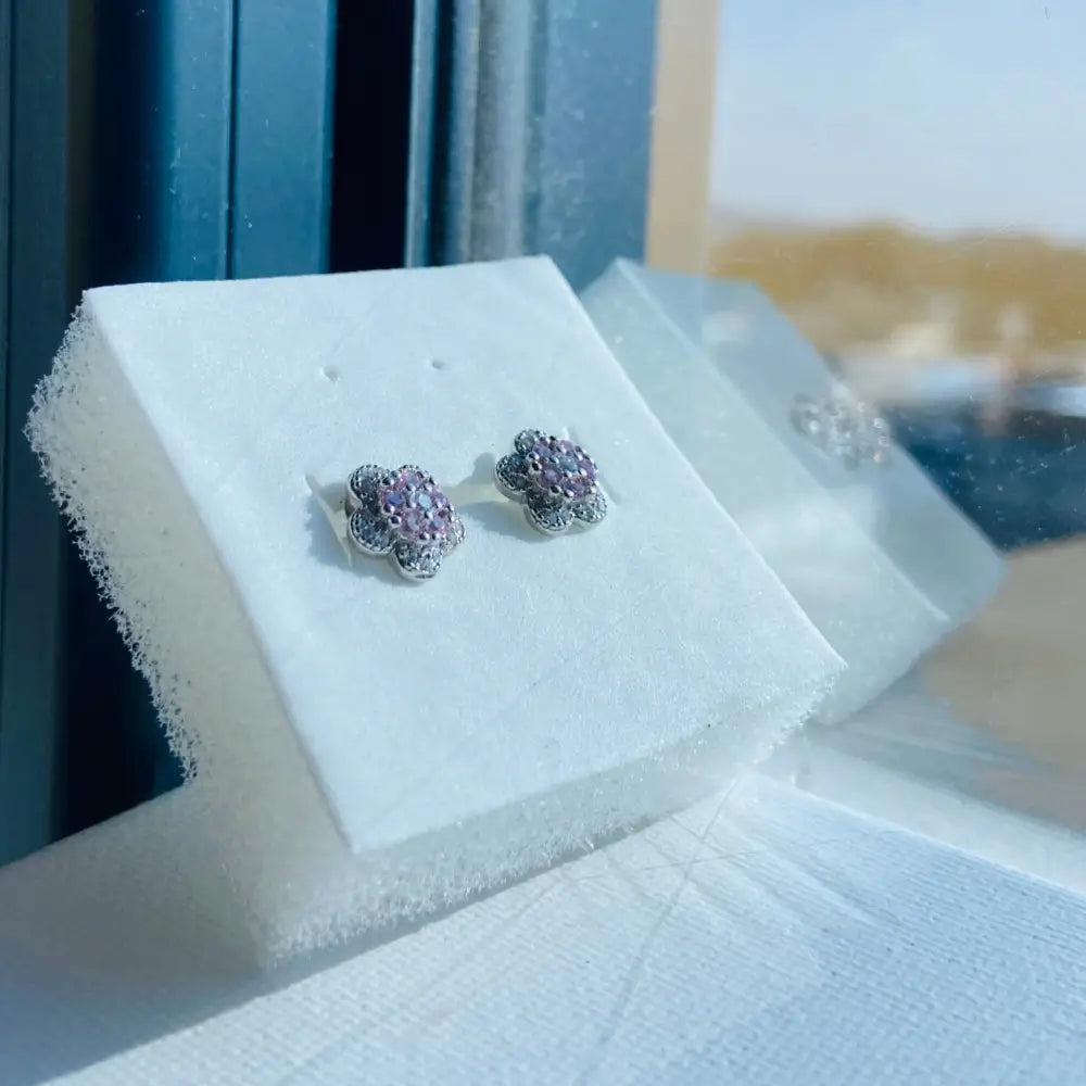 Silver pink rose flower-shaped stud earrings with pink gemstones in radiant silver finish