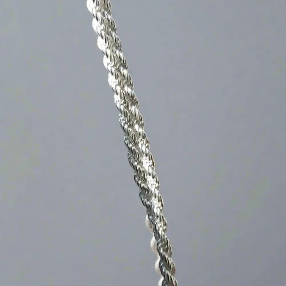 Two interwoven silver rope chains showcasing the Radiant Silver Rope Chain for daily shine