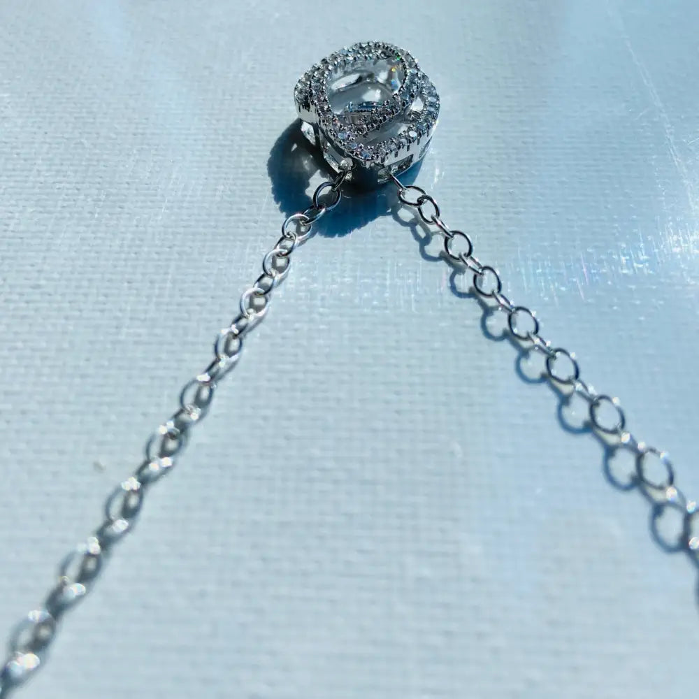 Silver chain necklace with heart-shaped diamond-encrusted pendant from Radiant White Gold Dancing Eye Necklace collection. Jewellery silver jewellery Deep Shine Jewellers