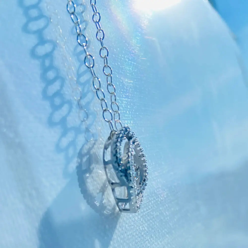 Silver chain necklace with sparkling oval-shaped pendant from the Radiant White Gold Dancing Eye Necklace collection. Jewellery silver jewellery Deep Shine Jewellers