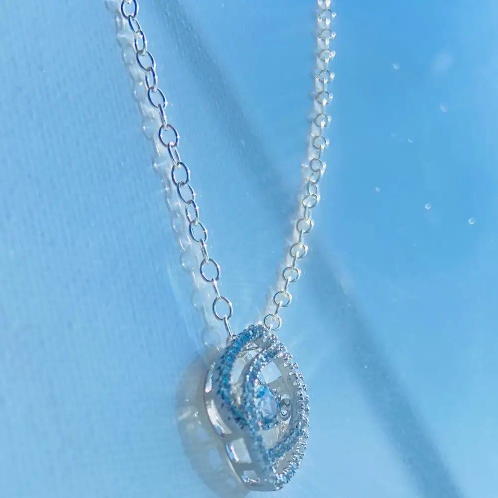 Silver white gold dancing eye necklace with teardrop pendant and sparkling gems. Jewellery silver jewellery Deep Shine Jewellers