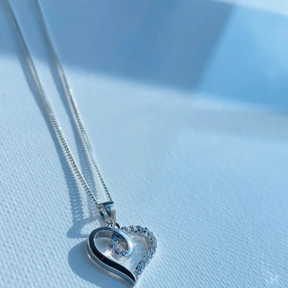 White gold silver heart pendant necklace with cubic zirconia accents from Radiant White Gold Heart Necklace Sparkle. jewellery silver jewellery. Deep Shine Jewellers