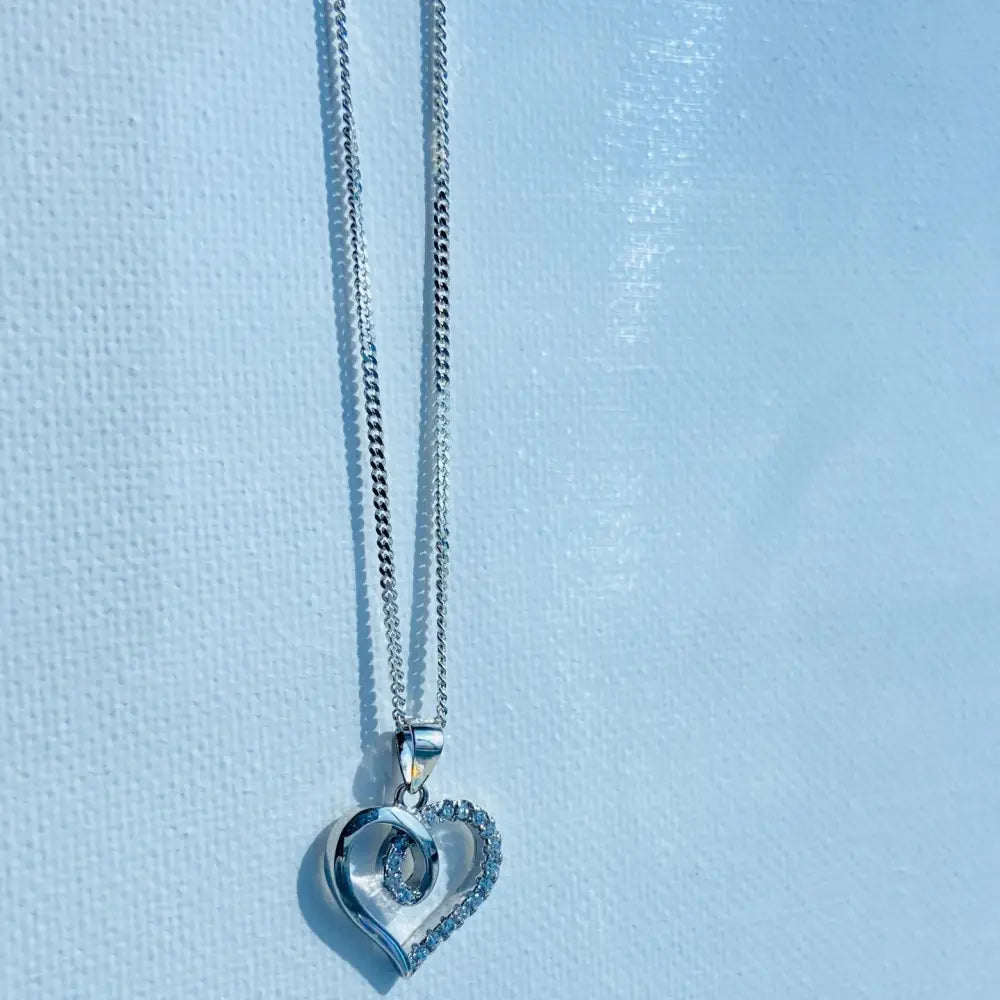 White gold silver heart pendant necklace with cubic zirconia accents from Radiant White Gold Heart Necklace Sparkle. jewellery silver jewellery. Deep Shine Jewellers