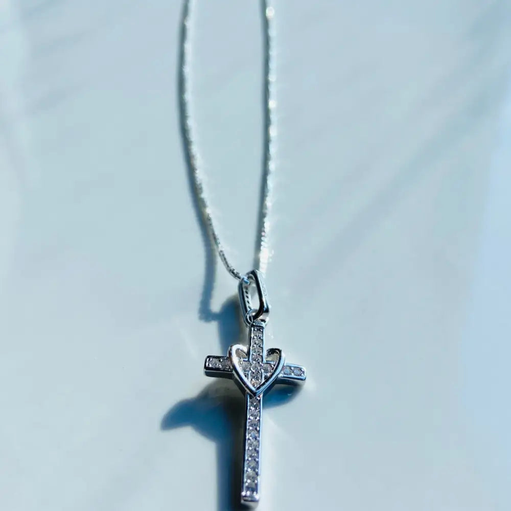 White gold silver love cross necklace with heart design and pavé-set gemstones. jewellery silver jewellery. Deep Shine Jewellers
