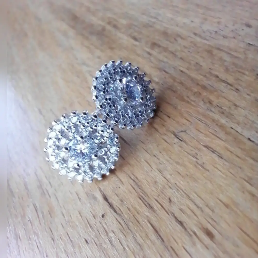 White gold silver stud earrings with clear gemstones and sparkling accents for elegant jewelry