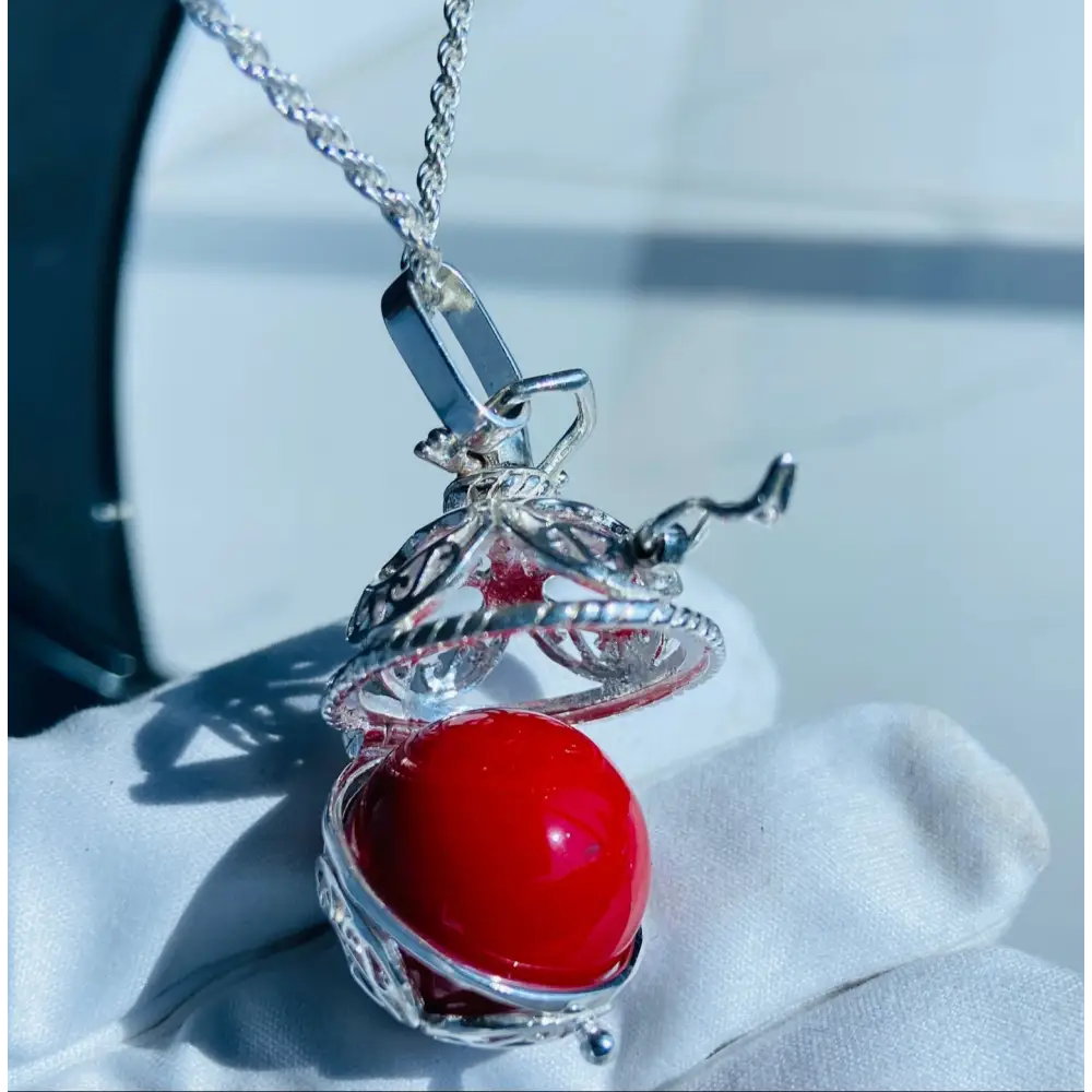 Silver locket casing with filigree design and vibrant red bead in Scarlet Heart Silver Locket Adornment. Jewellery silver jewellery. Deep Shine Jewellery