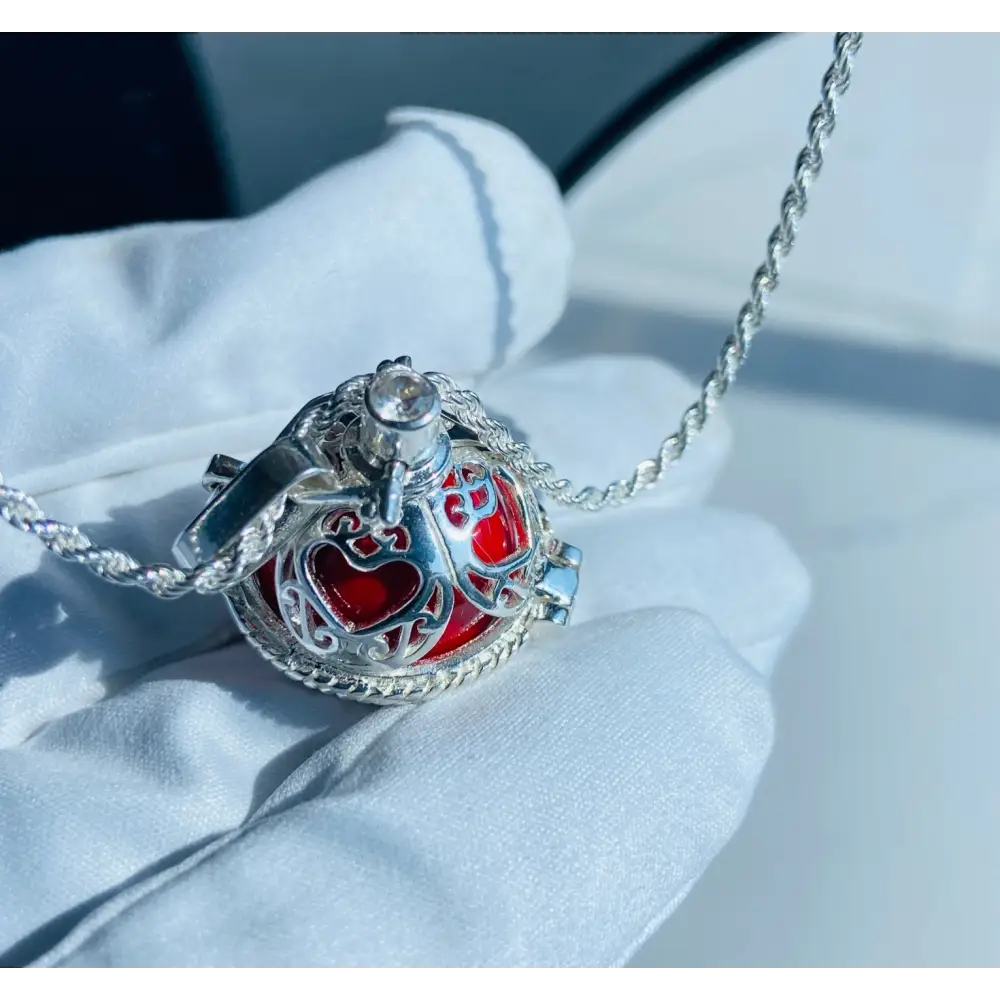 Silver locket casing featuring a heart-shaped design with a red interior for Scarlet Heart Silver Locket Adornment. Jewellery silver jewellery. Deep Shine Jewellery