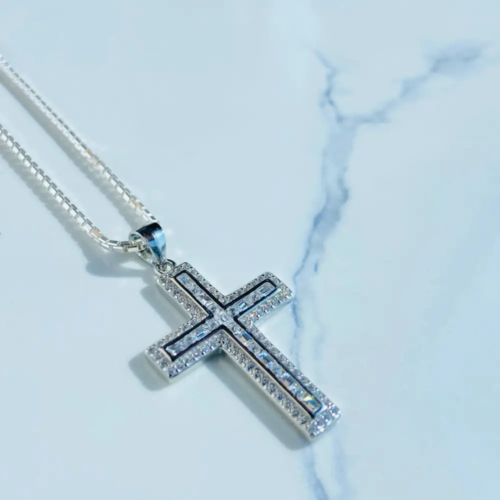 Sparkling silver flooded ice cross pendant with clear gemstones on delicate chain