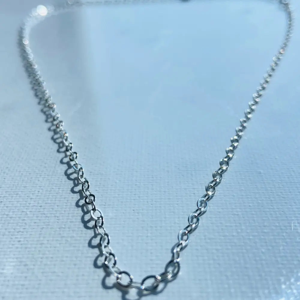 Silver cable chain necklace highlighting our Shine Bright product collection