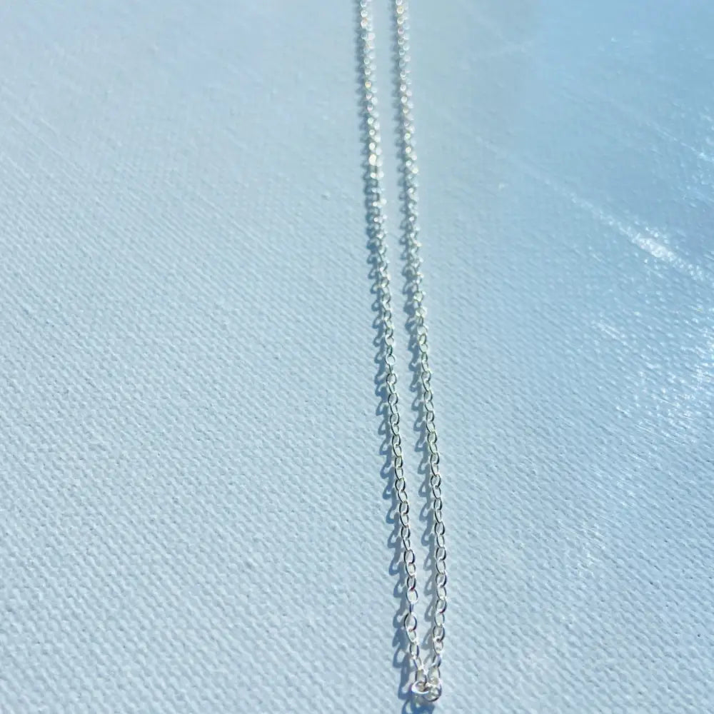 Silver cable chain necklace highlighting our Shine Bright product collection