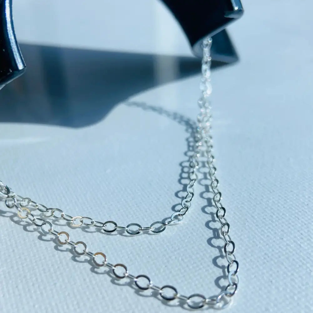 Elegant silver cable chain with small oval links for a sophisticated jewelry look