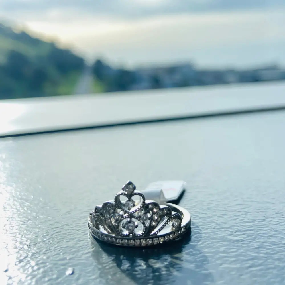 Silver Deep Shine Queen Crown Ring featuring a silver crown ring with clear gemstones