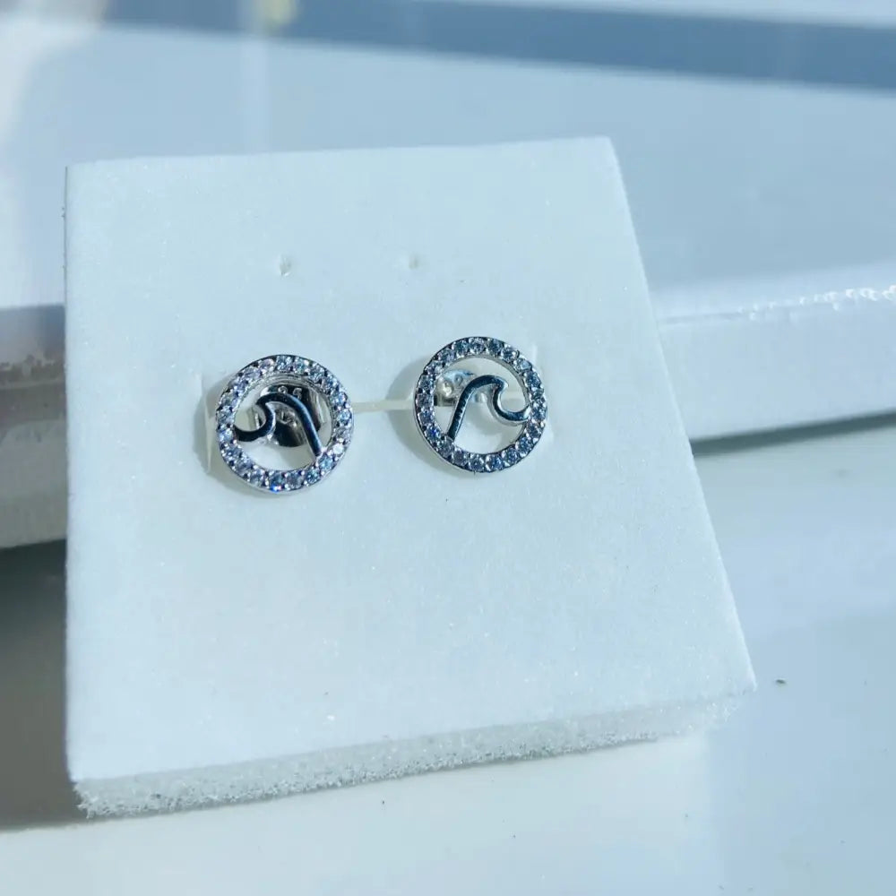 Silver Flooded Ice Wave Studs with circular design, letter S, and clear gemstone halo