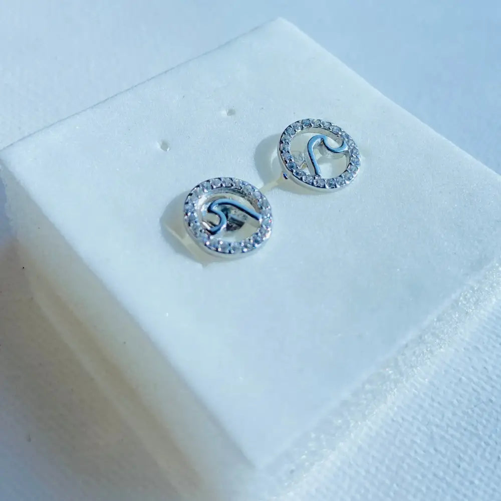 Sterling silver stud earrings with wavy design, cubic zirconia accents, from Silver Flooded Ice collection
