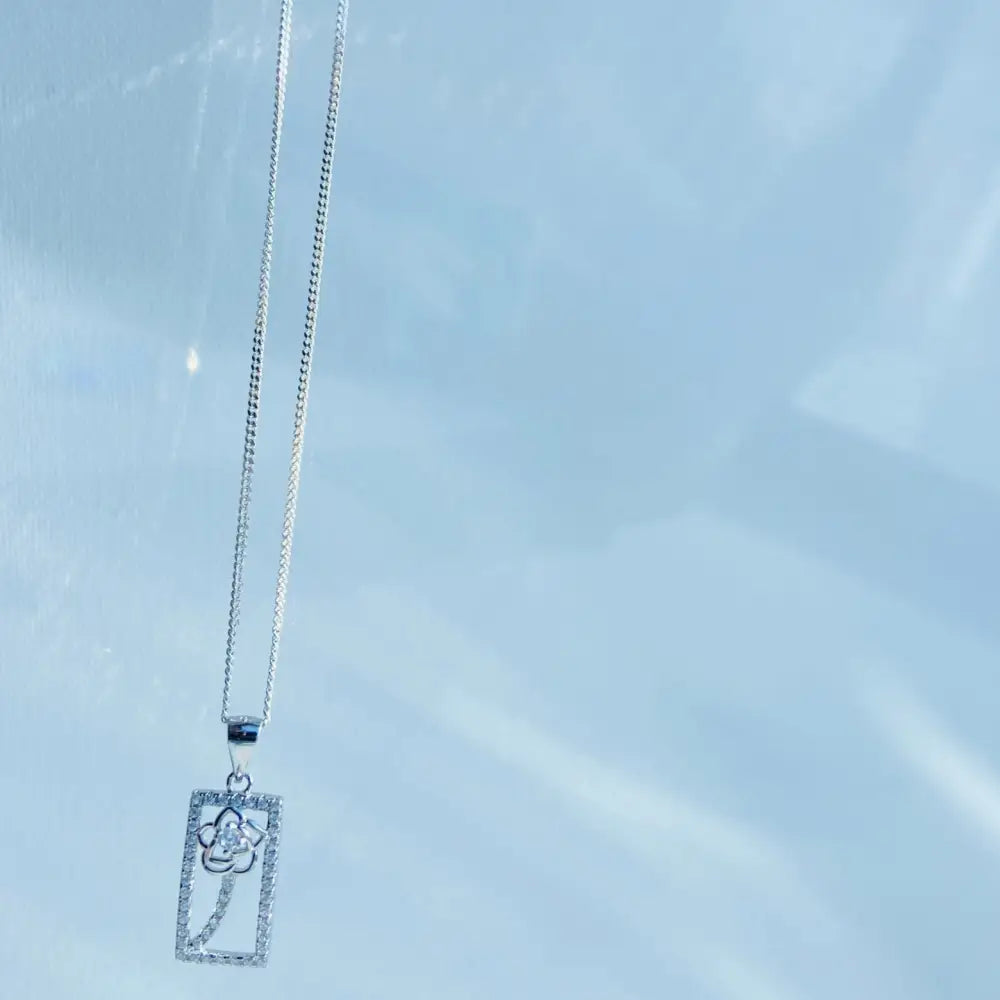 Elegant framed rose gold silver ice pendant necklace with floral openwork and gemstones. jewellery silver jewellery. Deep Shine Jewellers