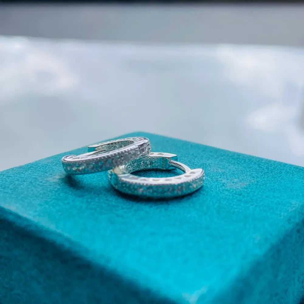 Silver flooded sleepers earrings with textured hammered finish for elegant style