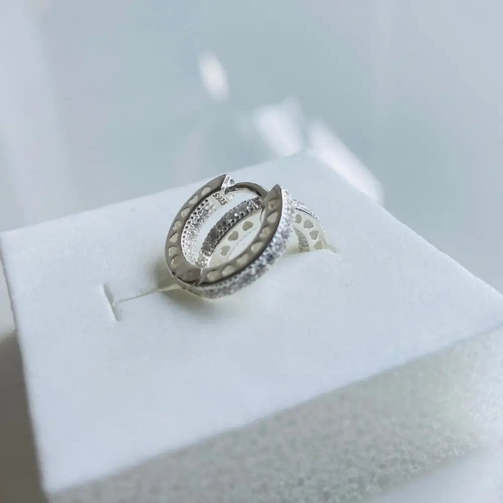 Silver flooded sleepers earrings with pave cubic zirconia and heart pattern for elegant style