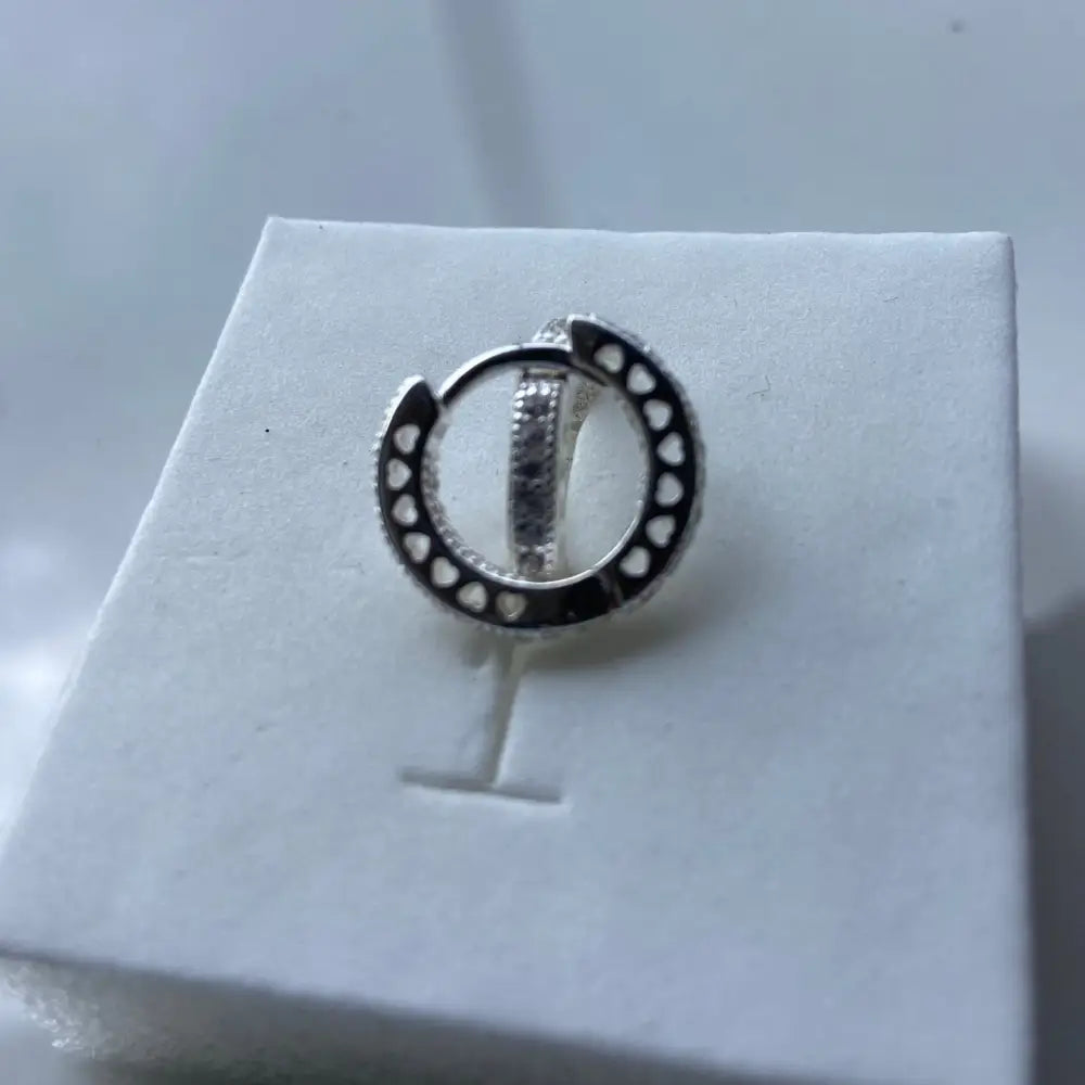 Silver flooded sleepers earring with heart cutouts and gemstones for elegant style