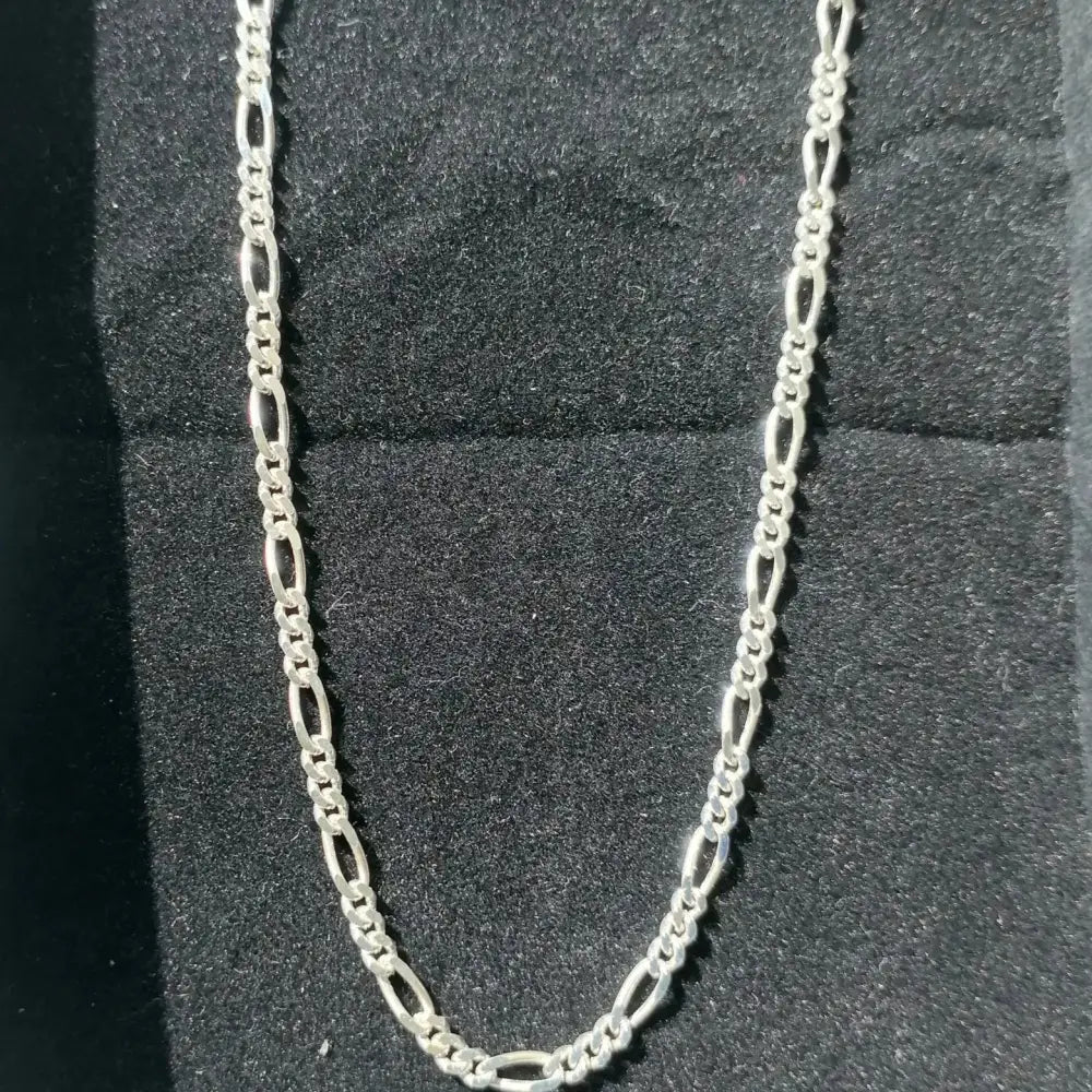 Sterling silver Figaro chain necklace with white gold finish showcasing elegant jewelry design. jewellery silver jewellery. Deep Shine Jewellers