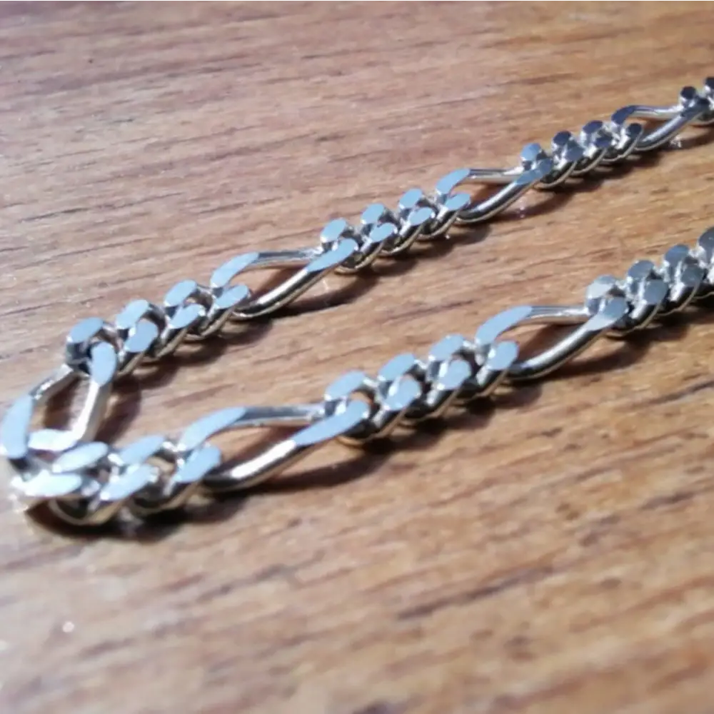 Silver-toned Figaro chain necklace with interlocking links in white gold silver finish. jewellery silver jewellery. Deep Shine Jewellers
